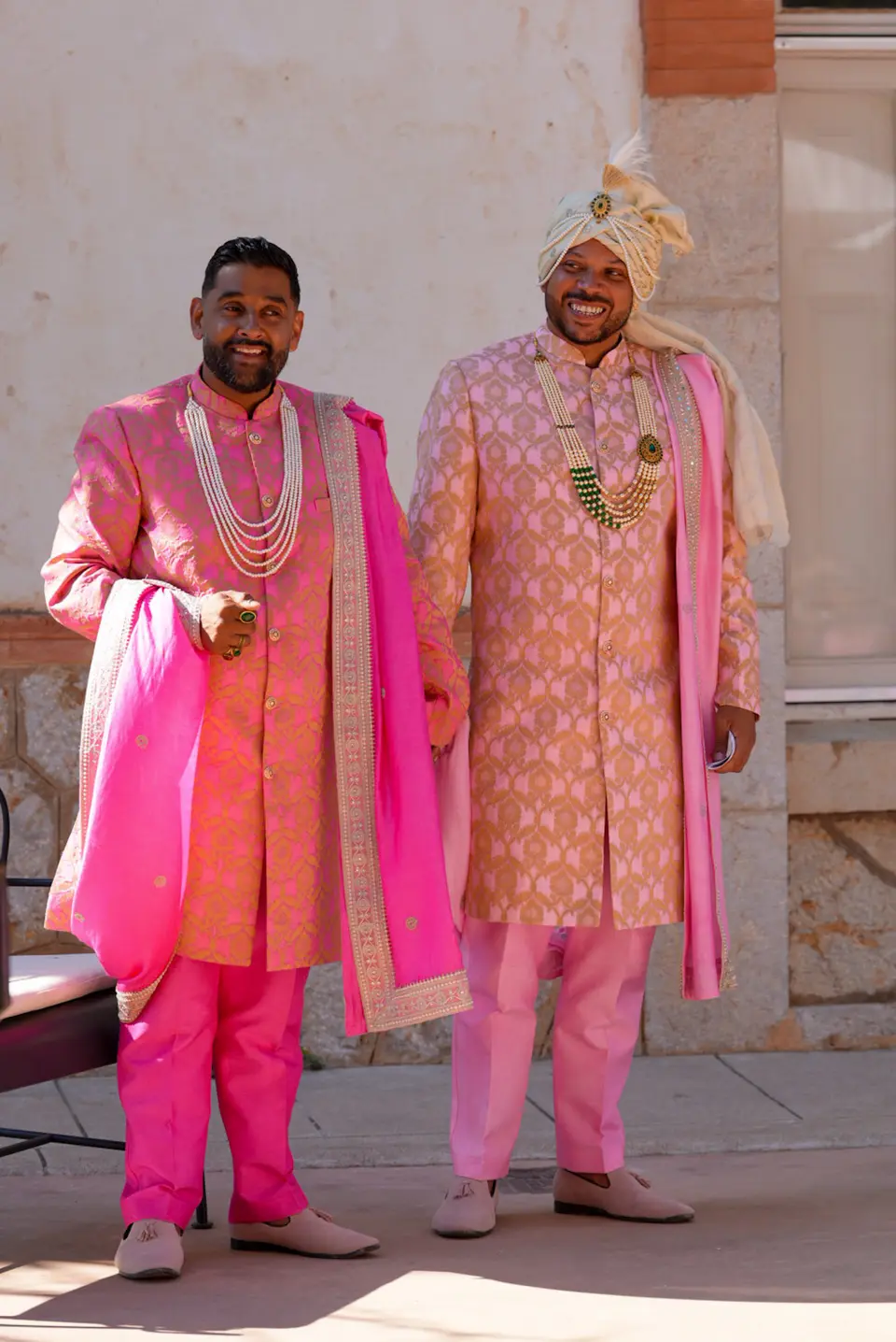 Wedding guests seated outdoors in coordinated pink attire